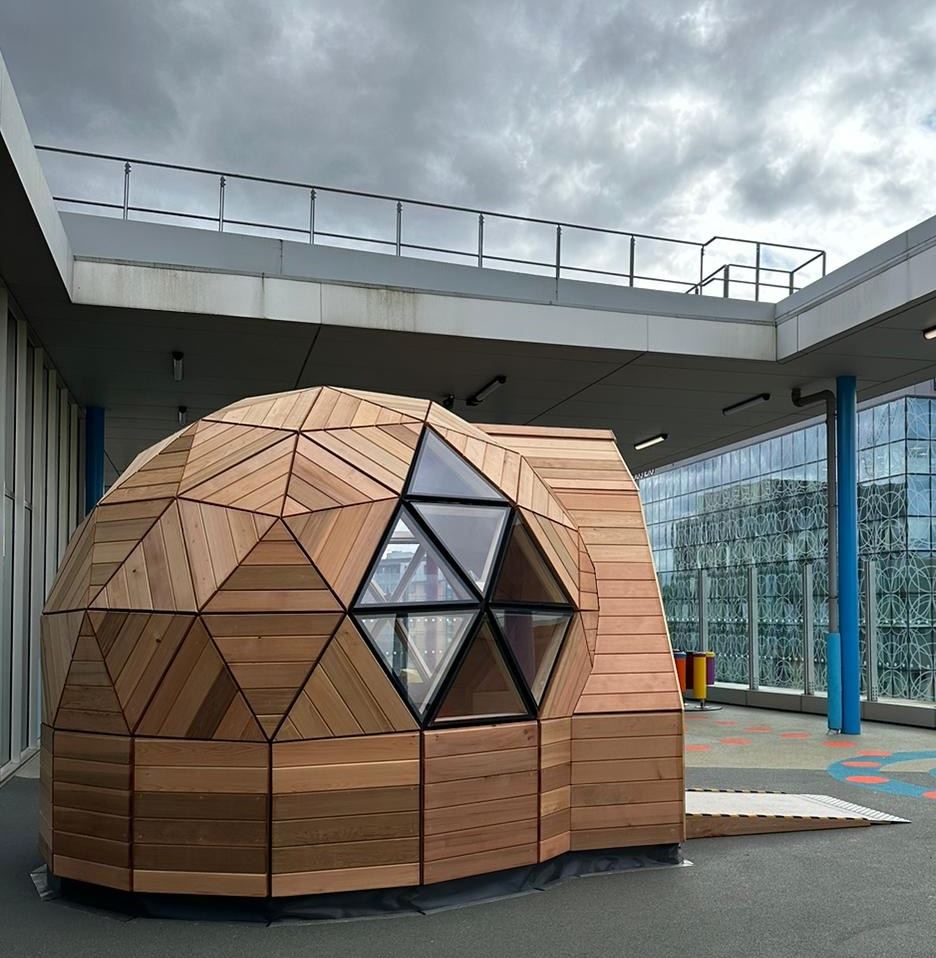 The Huggy Pod from the side, showing the triangular window panels