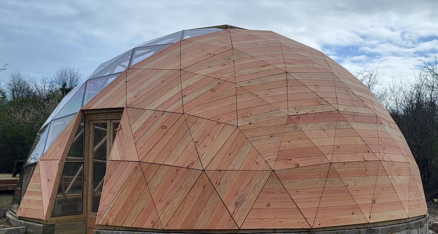 Douglas fir cladding meeting the multi-panel polycarbonate glazing